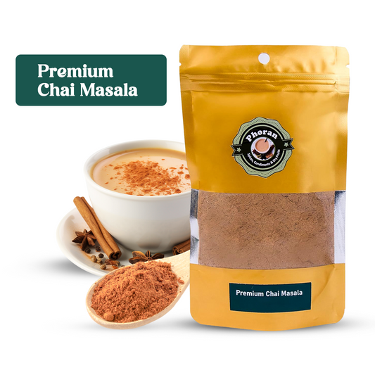  Phoran Premium Chai Masala in a yellow bag with a spoonful of chai masala powder